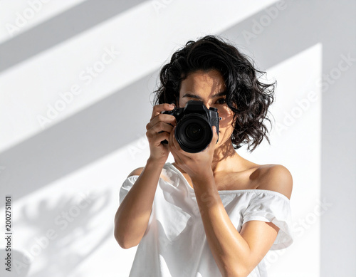 woman taking pictures with a camera