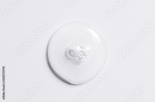 Cosmetic product in the form of a transparent drop. A moisturizing gel or serum for the face.