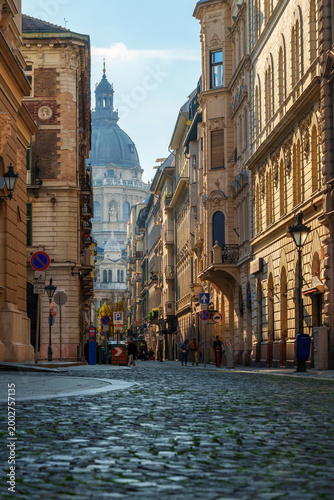 Beautiful street view of historic architecture and cobblestone road in Budapest Hungary with classical buildings and old city atmosphere under bright daylight