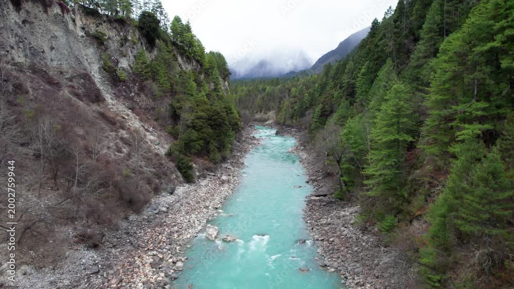 Drone view Parlung Zangbo river running along G318 or China National Highway 318 between Bomi and Baxoi County, Tibet, China, beautiful turquoise water in valley, 4k real time footage travel concept.