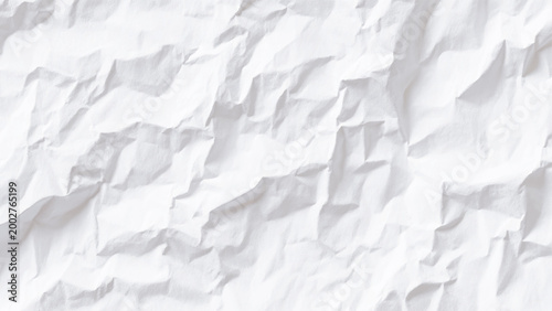 Crumpled white paper texture background with creases and folds