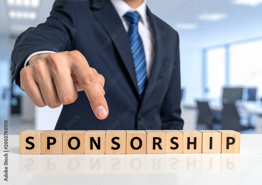 Obraz premium Sponsorship - Geschäftsmann zeigt auf den Text 