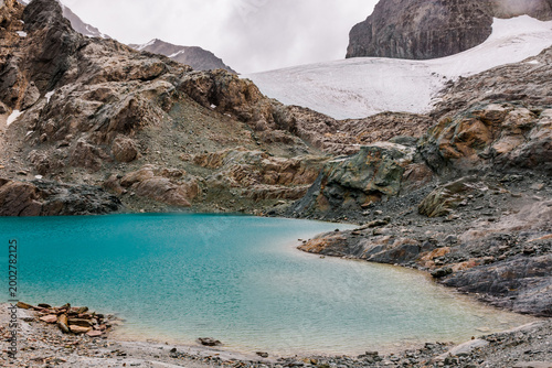 Turquoise waters of Laguna Celeste high alpine lake at the foot of Glaciar Alvear.