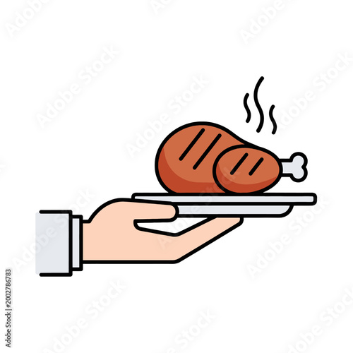 A hand holding a plate with a freshly cooked piece of roasted poultry meat