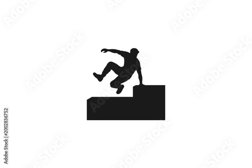 Man performing parkour jumping over obstacles silhouette