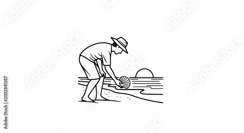 Person in hat bending to collect shell on beach at sunset