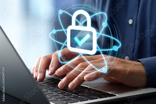 Post-quantum cryptography PQC. Secure data encryption and cyber security technology. Businessman using laptop computer with next-generation security solutions.