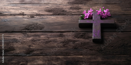 Rustic Christian Cross with Purple Flowers on Weathered Wooden Background and Wide Copy Space
