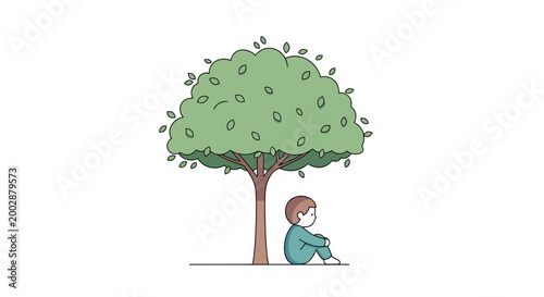 Boy sitting under a tree alone.