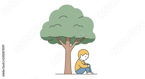Boy sitting under a tree.