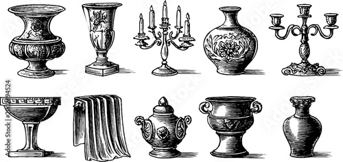 Decorative urns and candlesticks arranged on white surface