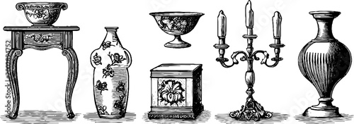 Antique table and decorative objects arranged on mantel