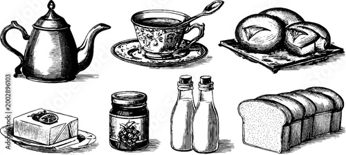 Teapot cup and breakfast bread items arranged on white backdrop