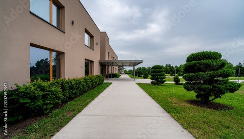 Modern building walkway with plants.