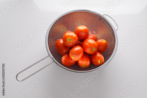 Fresh Red Tomatoes on white background.