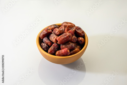 Dry Kimiya dates isolated on white background