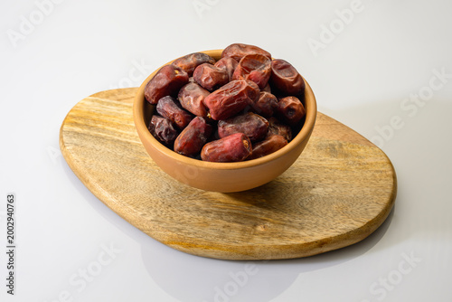 Dry Kimiya dates isolated on white background