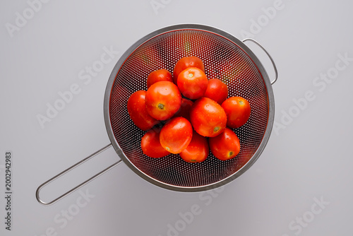 Fresh Red Tomatoes on white background.