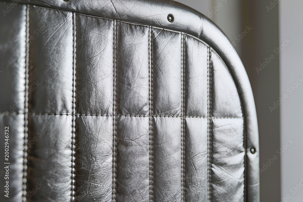 Fototapeta premium Silver metallic quilted thermal sauna pod interior padding texture close up