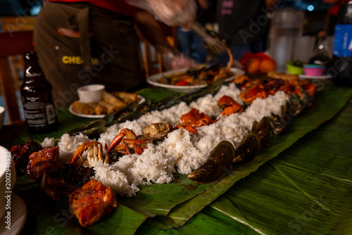 Traditional Filipino Boodle Fight feast on banana leaves