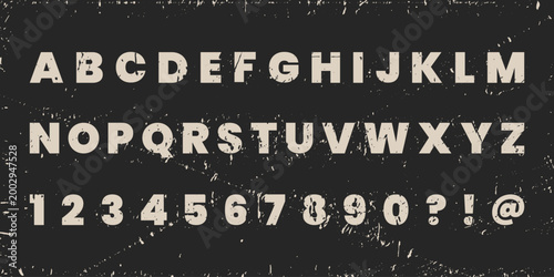 Font with grunge texture. Grunge fonts. Letters with worn, torn, and scratched edges on black background with texture. Perfect for vintage signs, posters or packaging, packagings, adv, and collages.