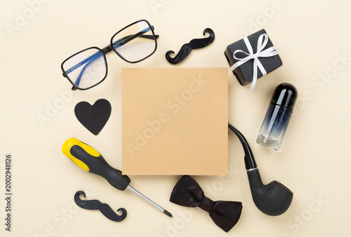Happy Father's Day accessories on color background, top view