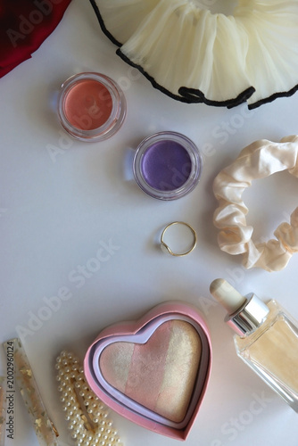 Various accessories and beauty products on white background. Coquette aesthetic. Flat lay.