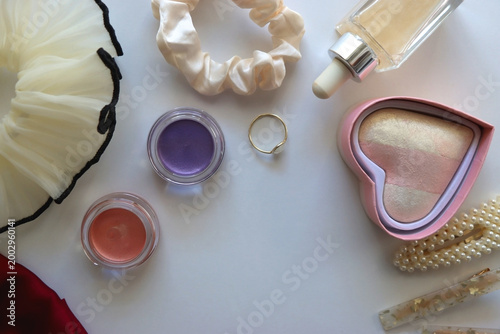Various accessories and beauty products on white background. Coquette aesthetic. Flat lay.