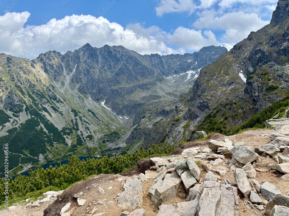 Fototapeta premium Rocky mountain valley with cloudy sky