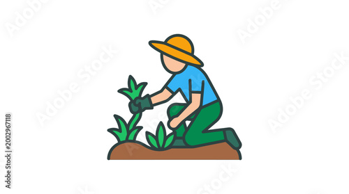 Man wearing gloves planting green plant.