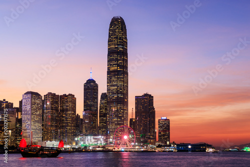 Canvas Print Hong Kong city skyline at sunset with glowing sky and skyscrapers