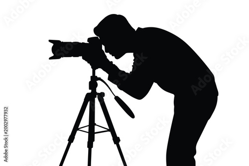 Silhouette of a focused photographer capturing a shot with a professional DSLR camera mounted on a sturdy tripod, isolated against a stark white background, evoking creativity, artistry, and technical
