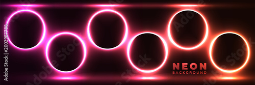 Neonlit circles in pink and orange hues on dark background for graphic design  vibrant colorful glowing rings for neon background