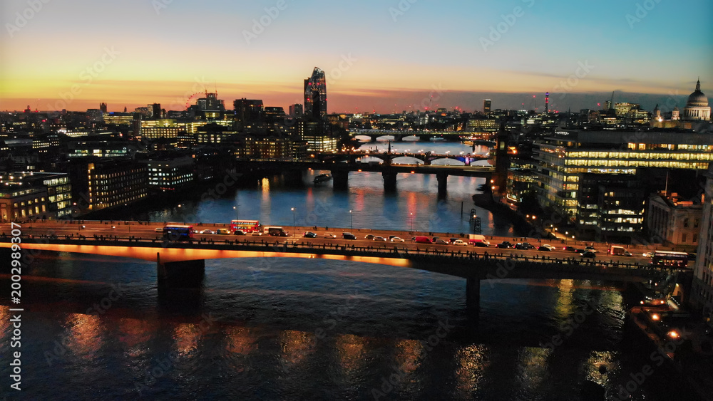 Fototapeta premium London city skyline with bridges over river thames at sunset