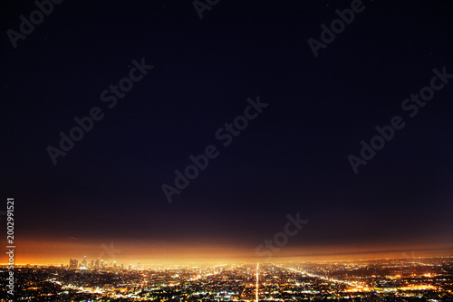 Los angeles city lights glowing at night skyline aerial