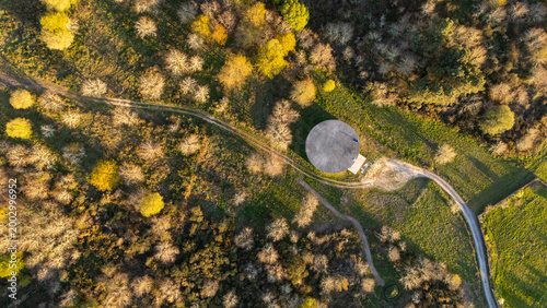 Aerial view concrete water tank and rural road