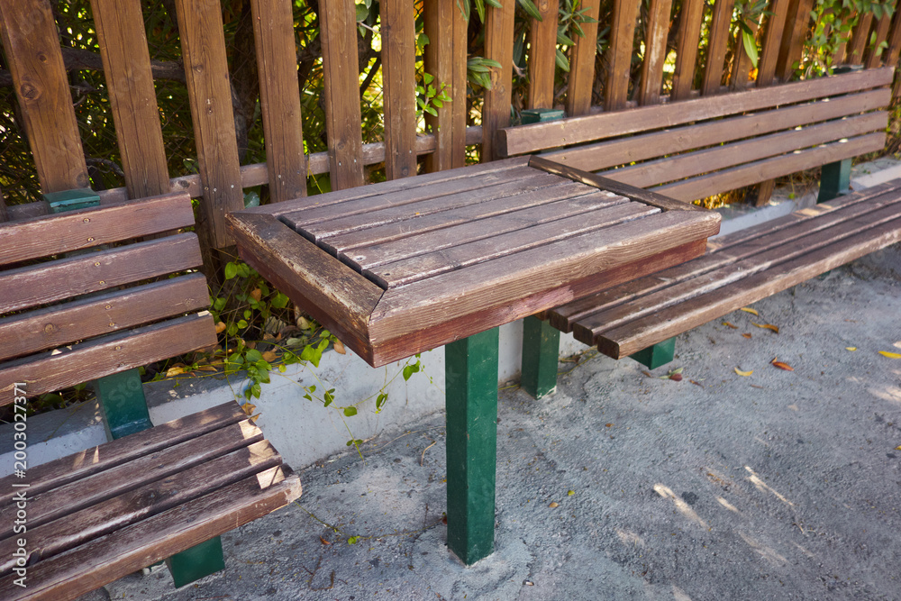 Fototapeta premium Benches with a table on a pedestrian street.