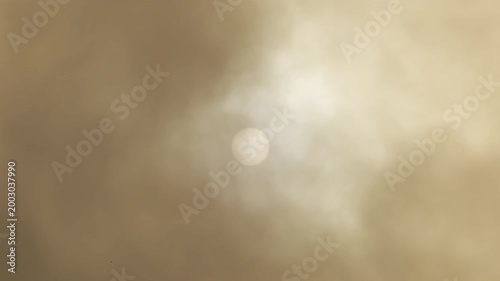 Sun with clouds of calima or kalima