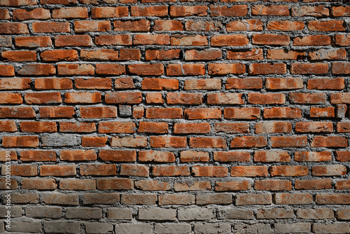 Old red brick wall texture, rustic masonry background.