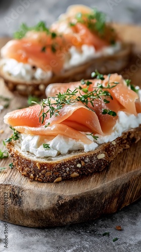 Closeup of toasted bread slices topped with smoked salmon and cream cheese