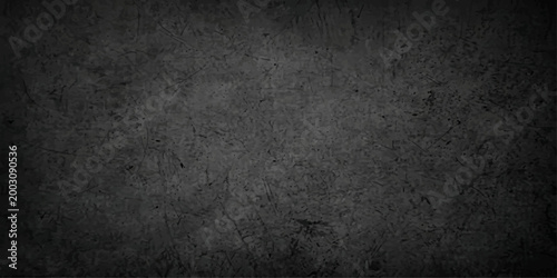 A weathered and textured dark gray background, its surface marked by subtle imperfections, creates a sense of depth and mystery. This abstract backdrop is suitable for various design applications.