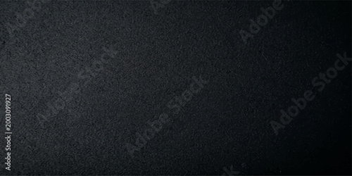 Abstract dark stone textured surface. A close-up shot of a rough, dark stone surface, revealing the intricate details and textures of the material, evoking a sense of depth and mystery.