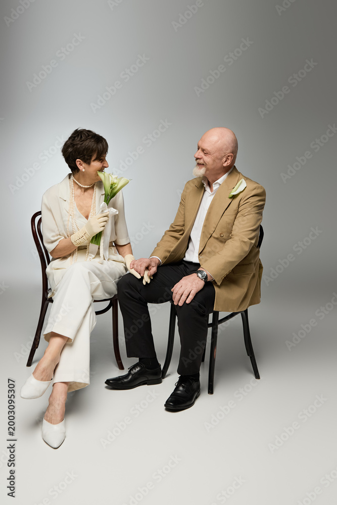 Fototapeta premium Senior couple sharing a loving moment while holding hands and enjoying each others company