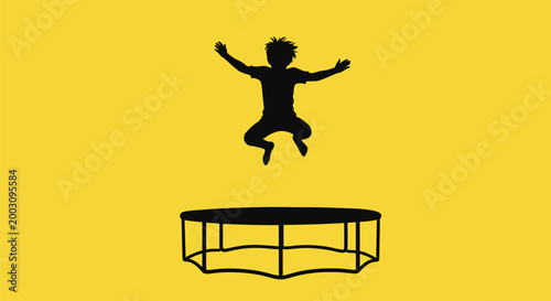 Child jumping on trampoline with arms out.