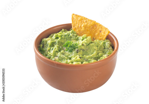 Quadro su tela Fresh guacamole dip in terracotta bowl with tortilla chip, mexican food isolated