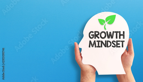 Foto Growth Mindset Concept with Human Head Silhouette on Blue Background