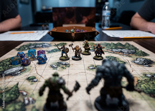 Fantasy tabletop role playing game miniatures on battle map