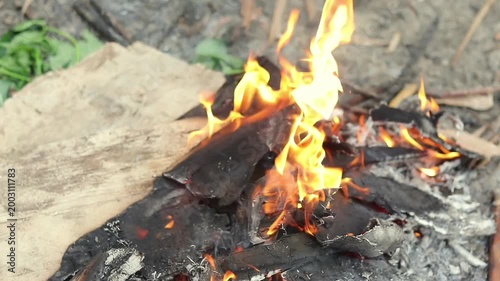 Close up view of a campfire in the field during the day