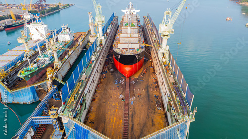 A full service shipyard and modern shipbuilding facility Dry dock with Cargo Ship maintenance or repair at floating dock