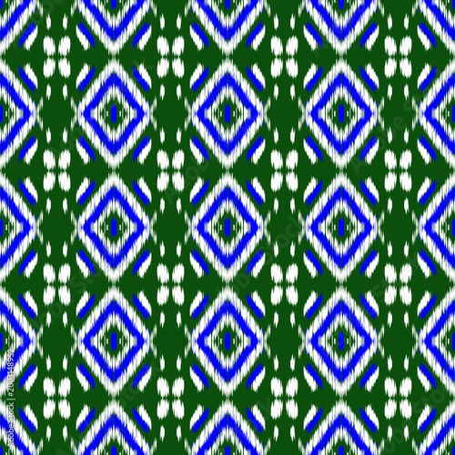 Geometric Diamond Shapes in Blue and White on Green Background